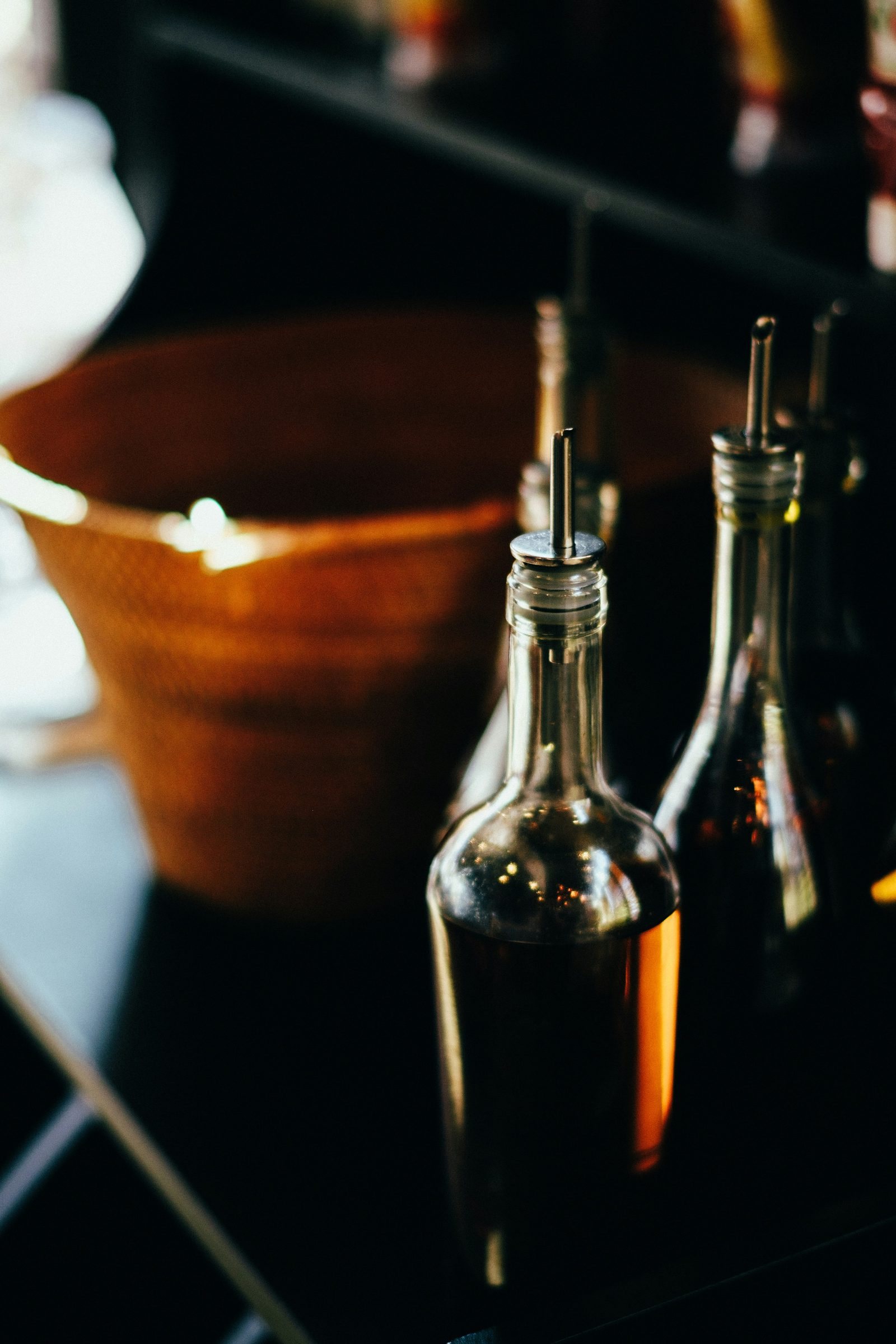 Bottles of olive oil in warm light