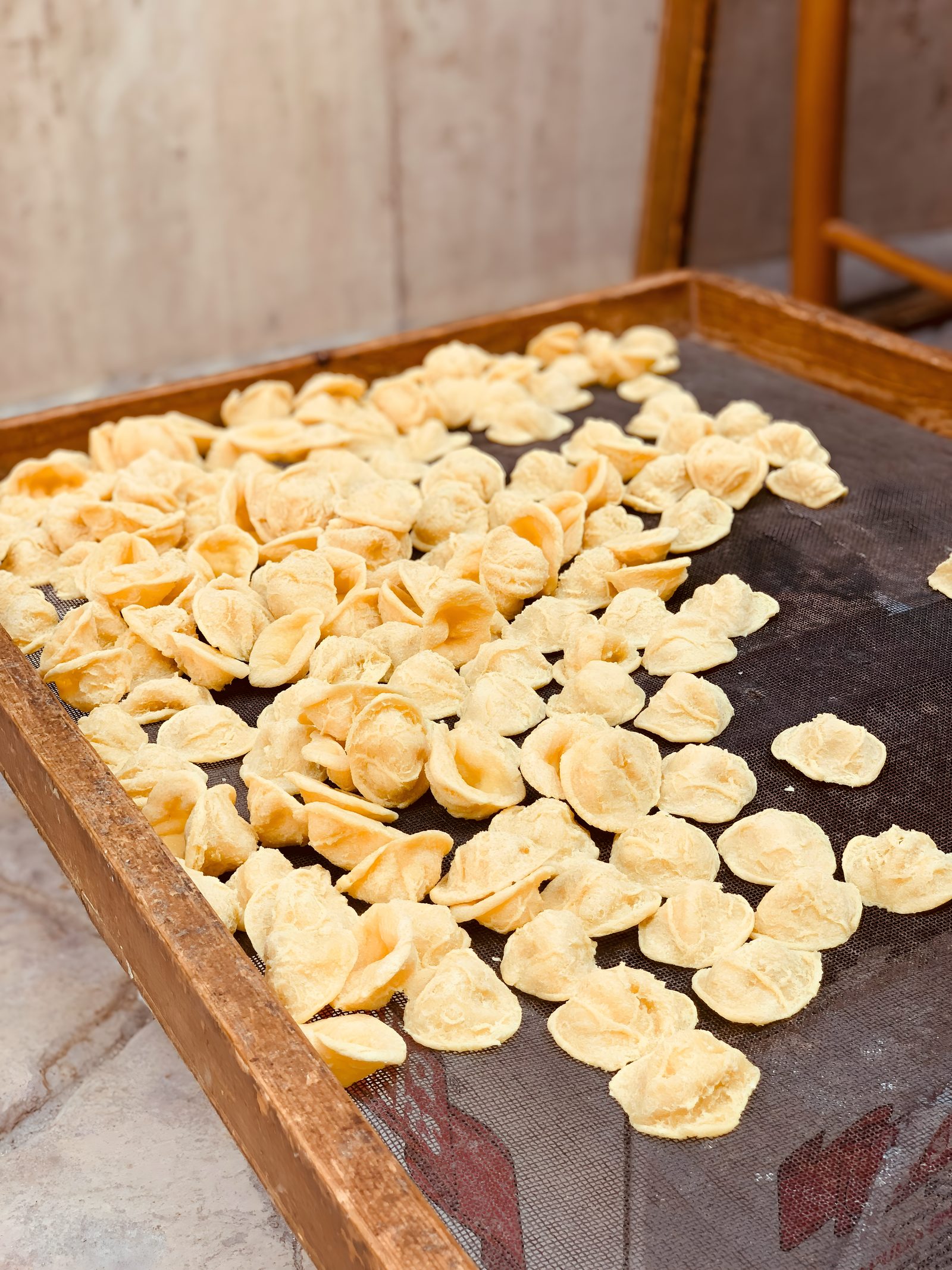 Fresh pasta drying on a tray